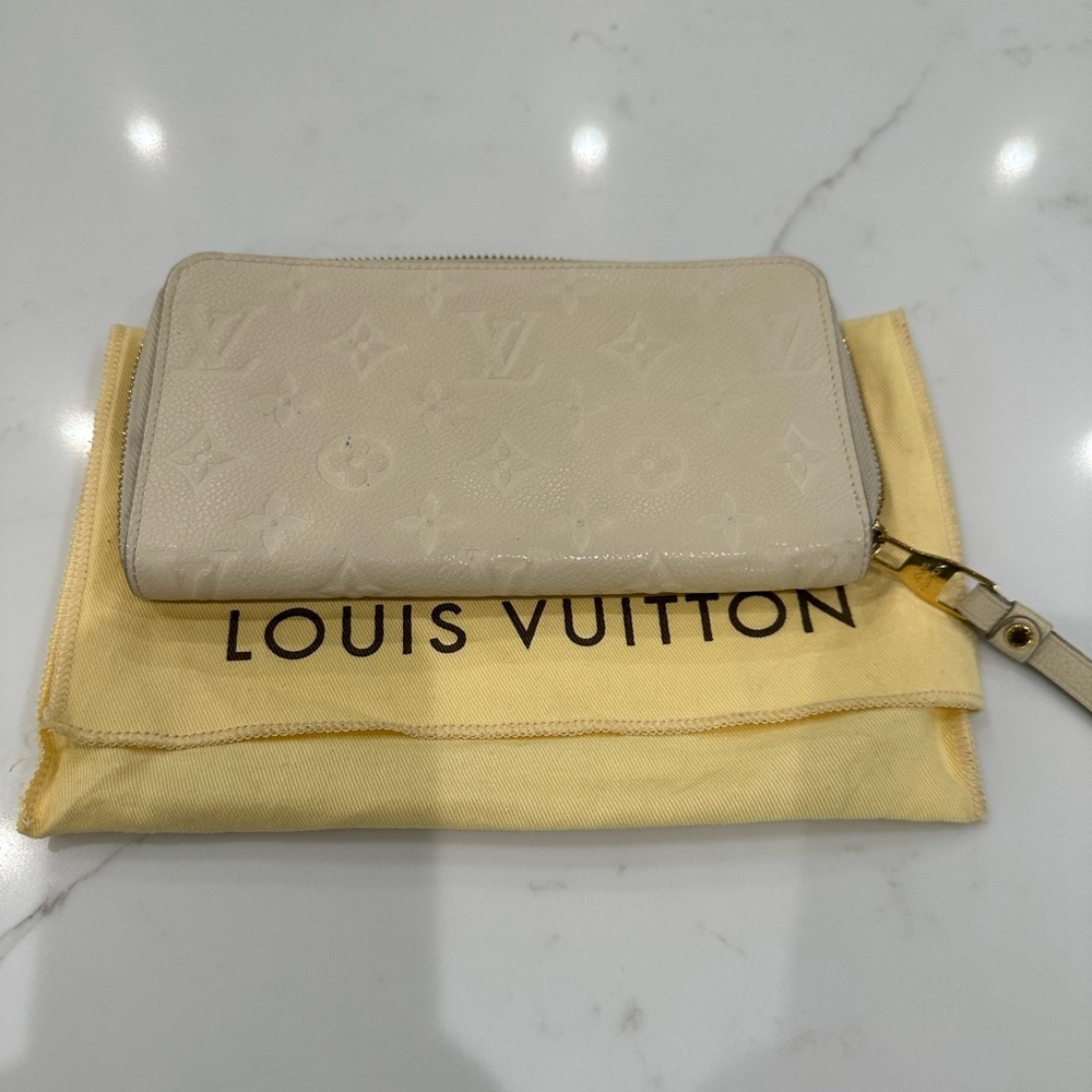 Louis Vuitton Empreinte Zippy Wallet in Neige